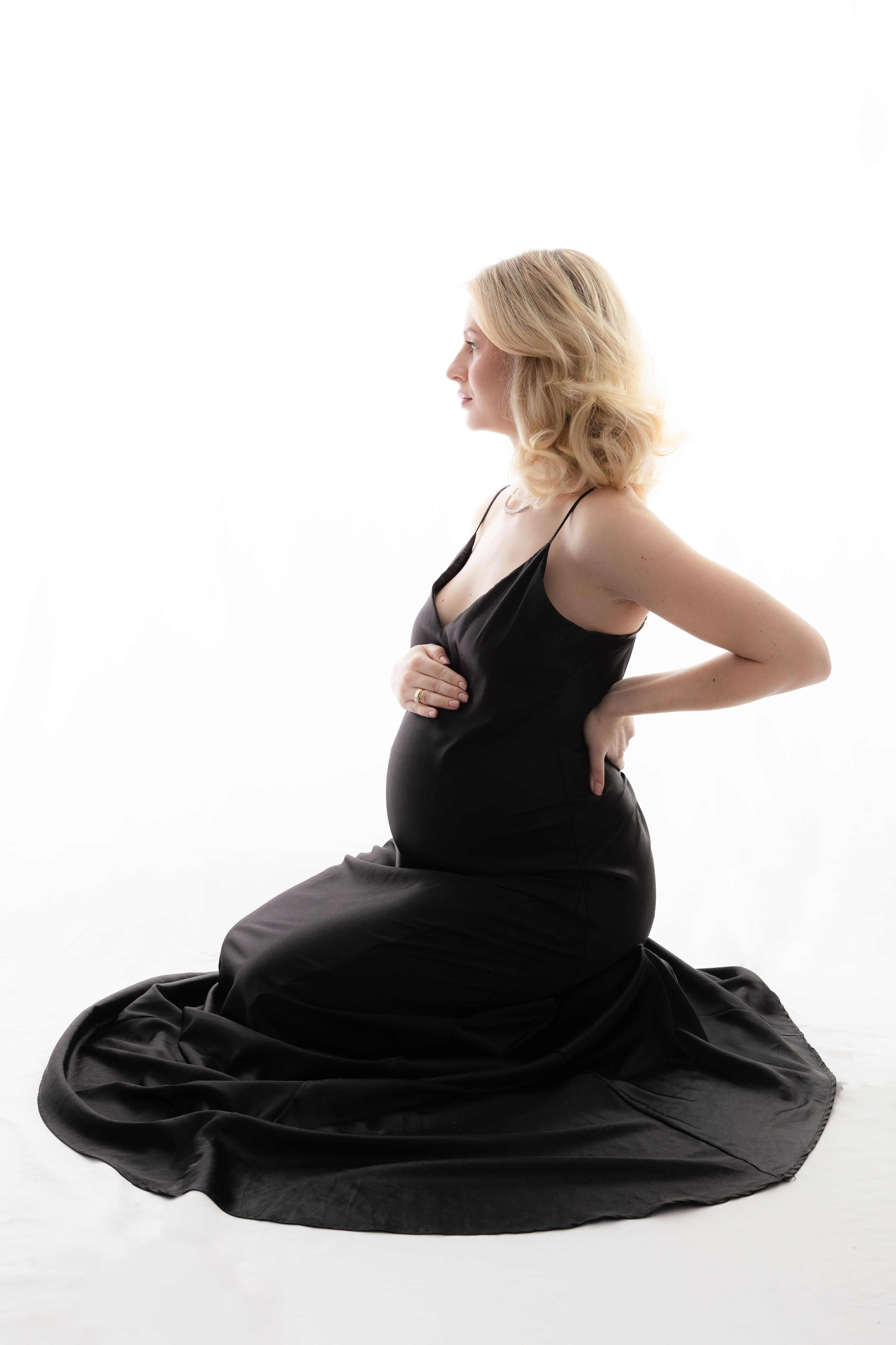 Fine art maternity photographer West Kelowna BC — serene studio session
