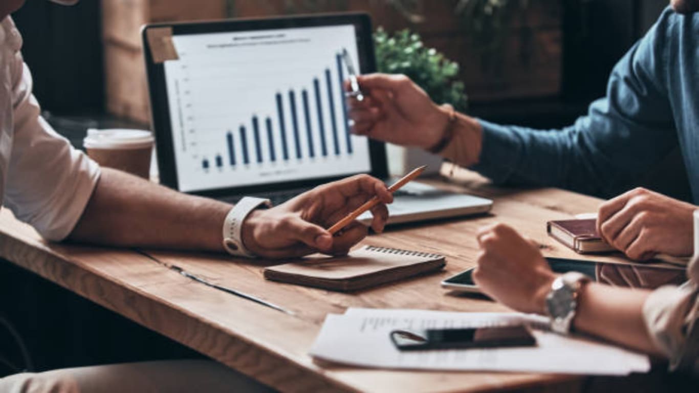 Brokerage leaders reviewing data