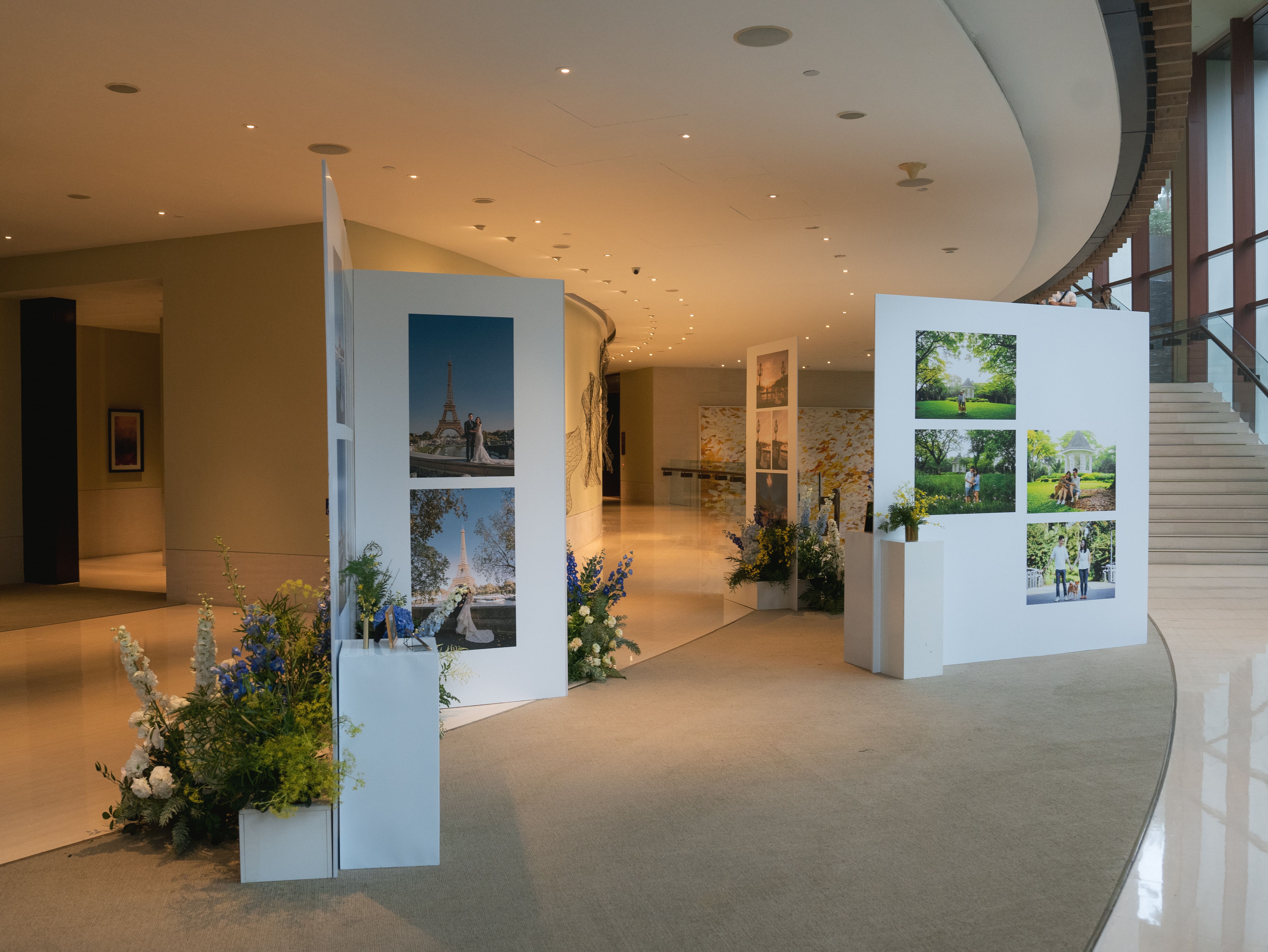 Side angle of gallery space with cohesive floral decor