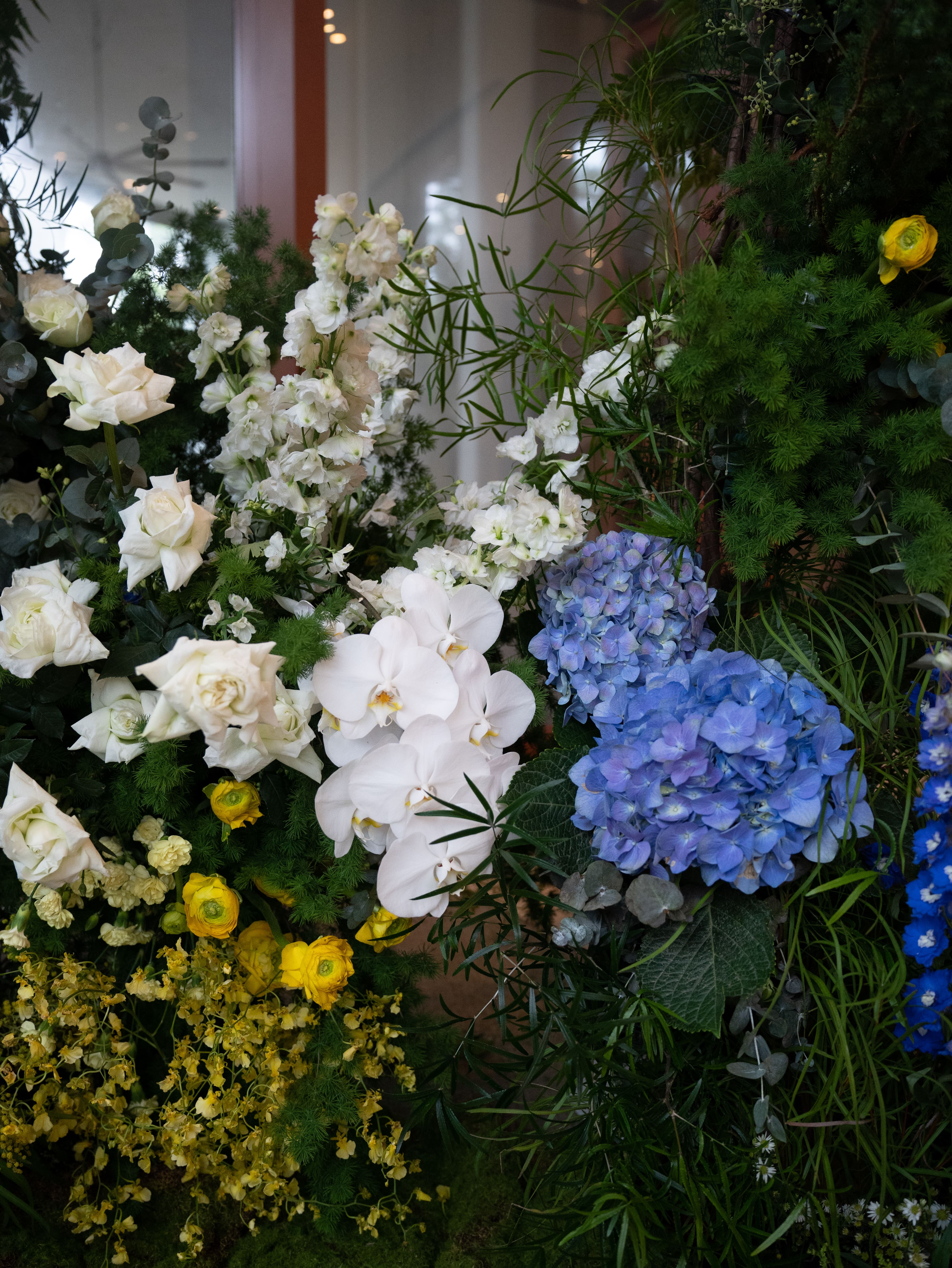 Entrance floral setup with hydrangeas, rosses, orchids and greenery
