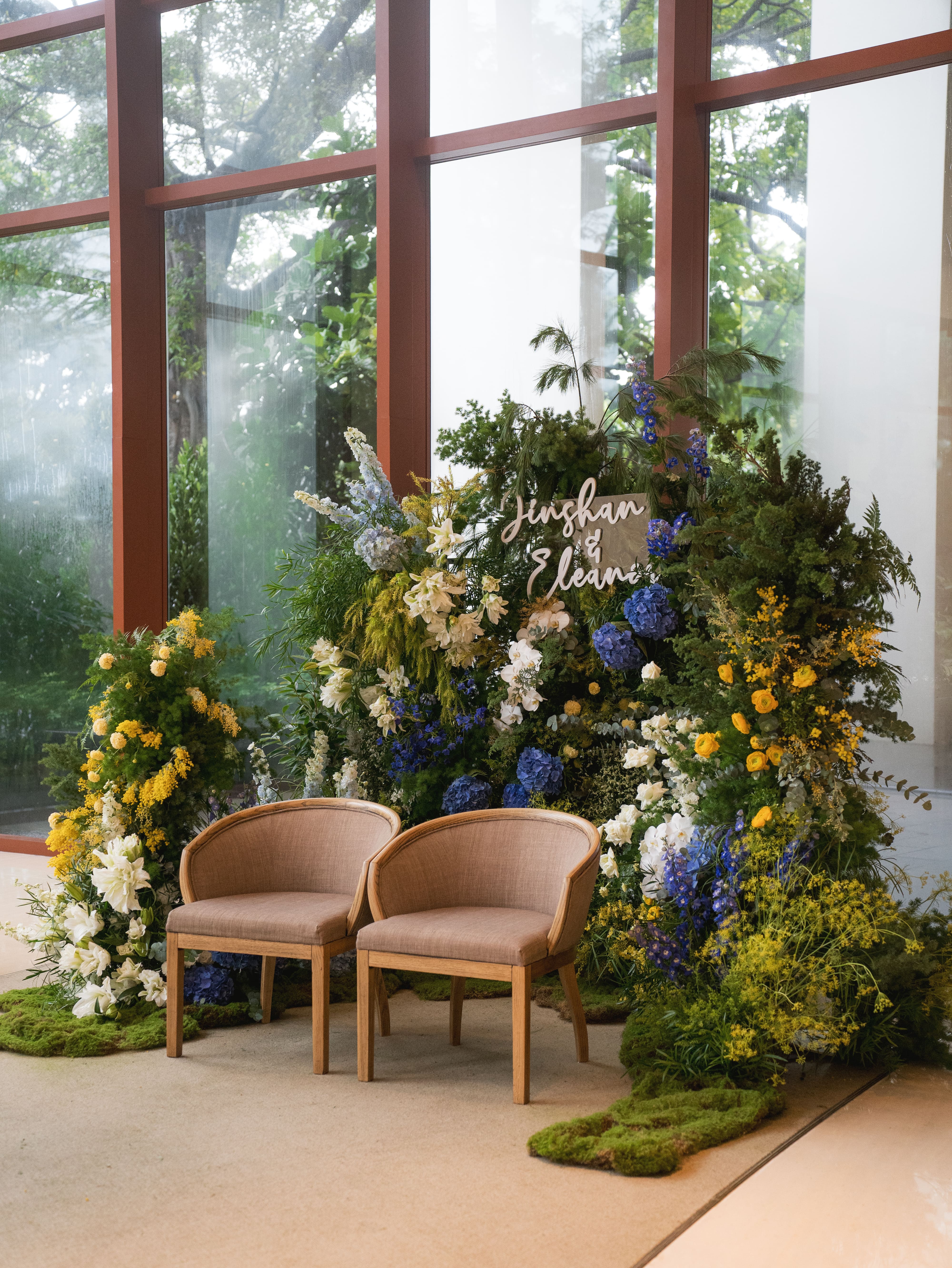 Wedding floral seating setup with blue and yellow tones at Capella Singapore