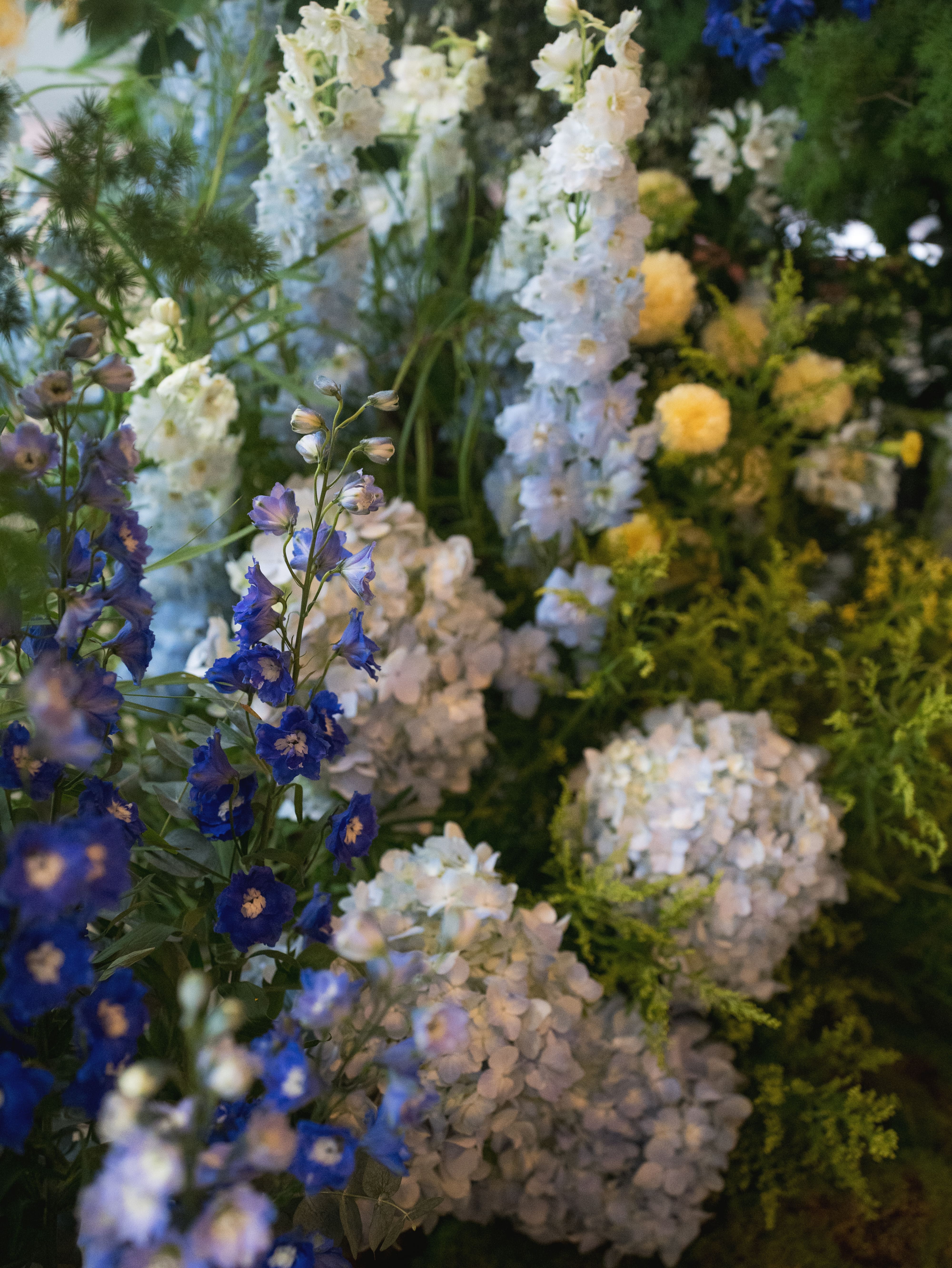 Close-up shot of blue and white floral installation