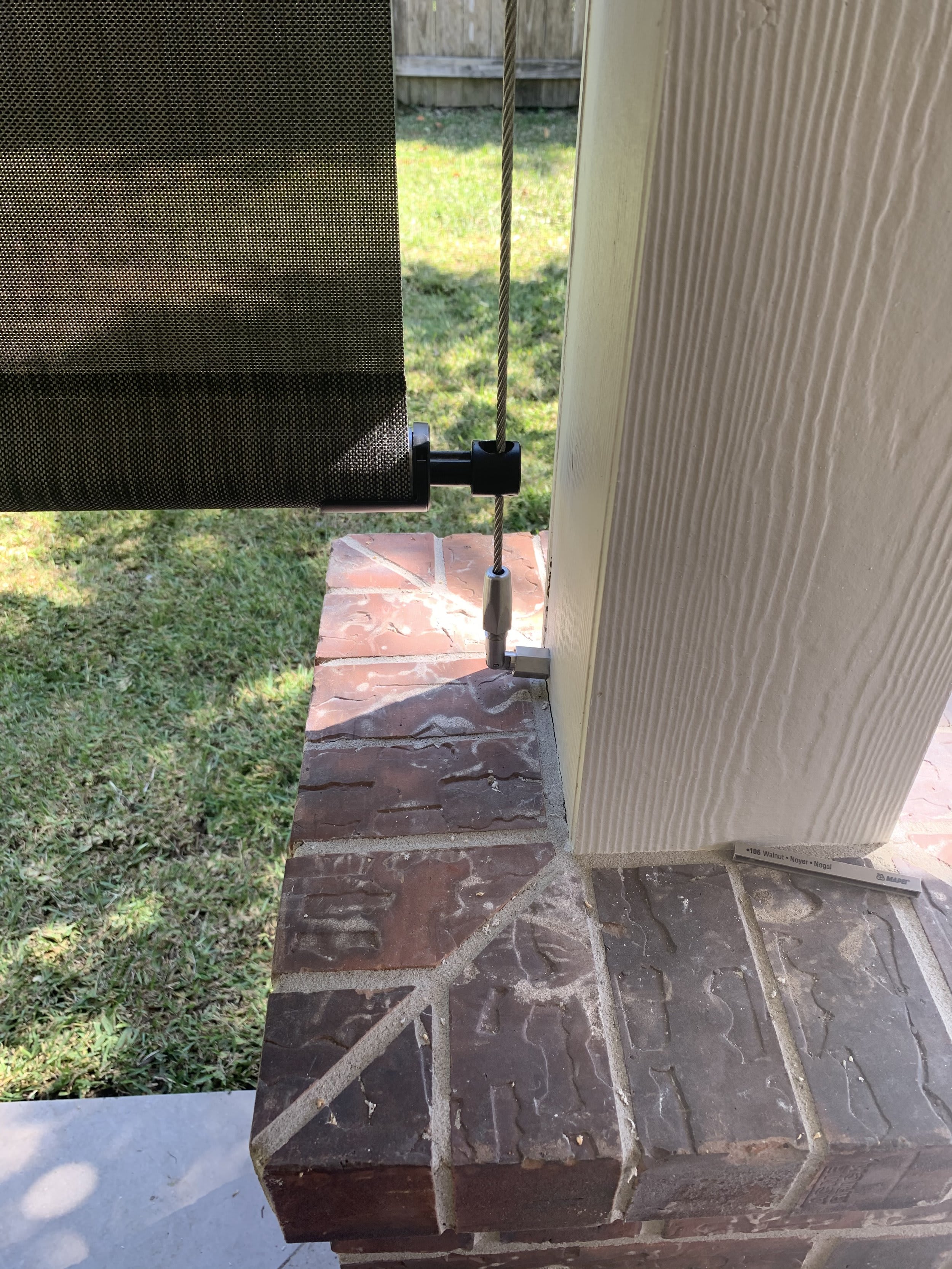 Cable-guided solar shades for patios and windows