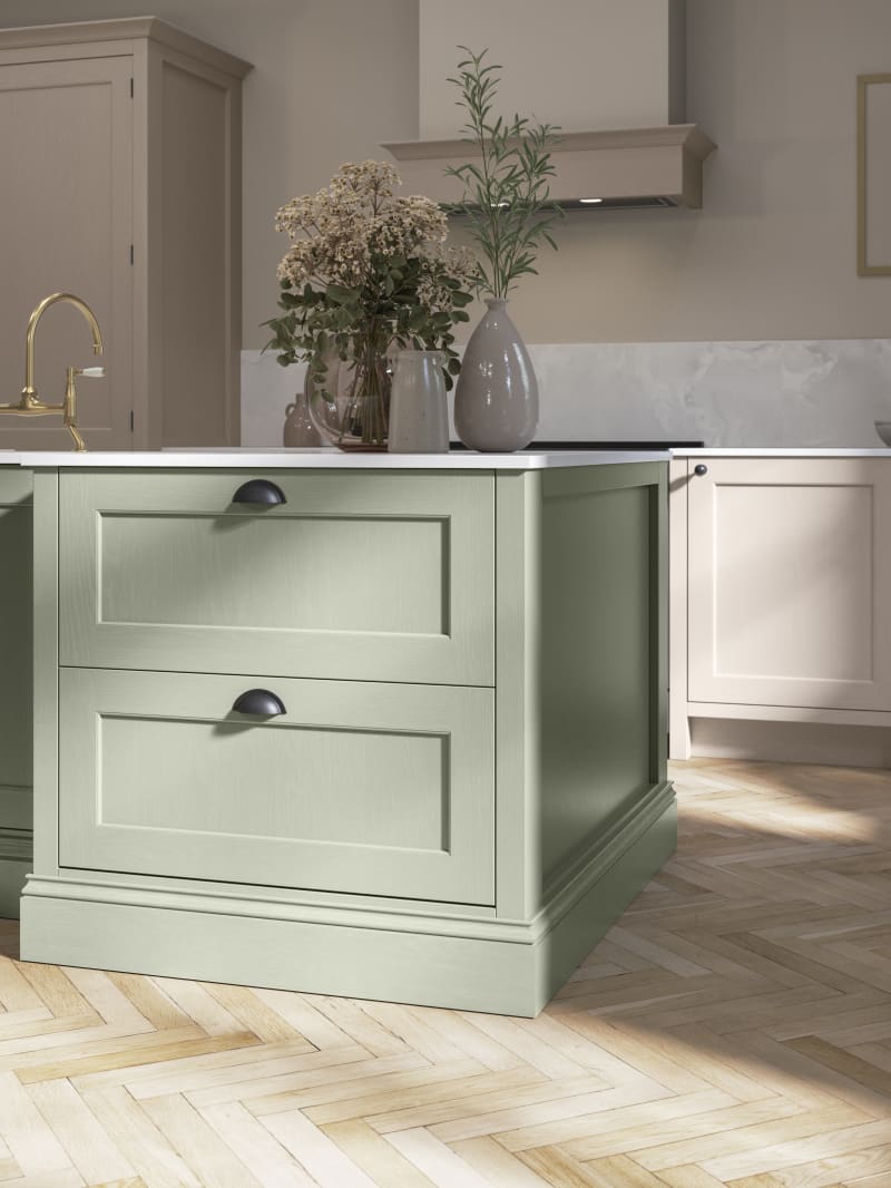 Traditional Shaker-style kitchen range Ludlow with tactile woodgrain in neutral shade Shell with a green Thyme kitchen island.