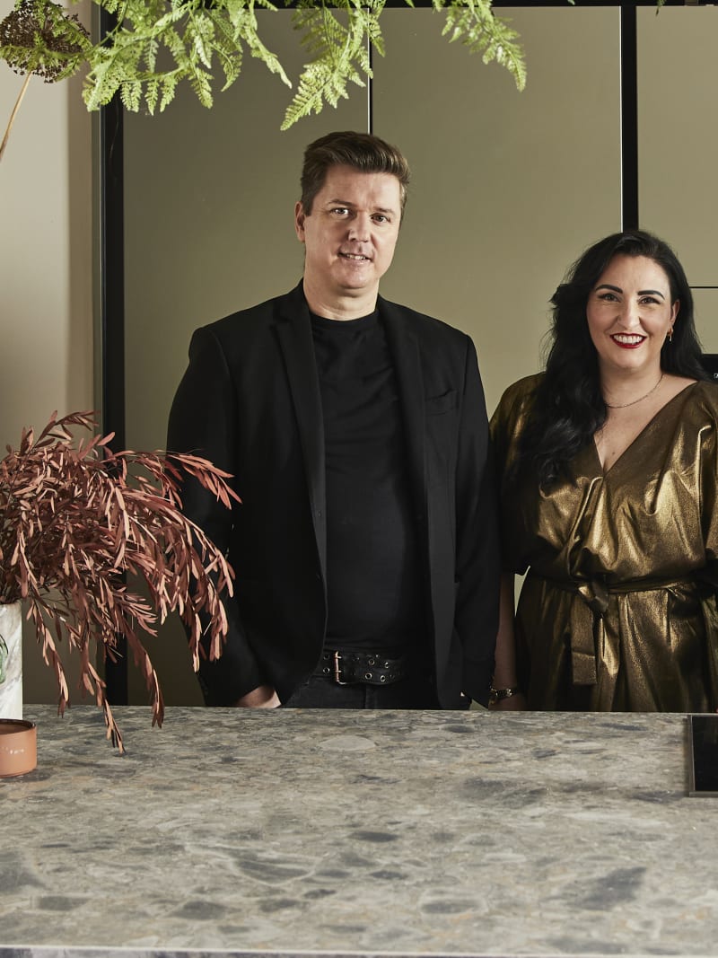 Ally and James Dowsing-Reynolds posing in their kitchen along with Jen Nash from Magnet