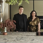 Ally and James Dowsing-Reynolds posing in their kitchen along with Jen Nash from Magnet