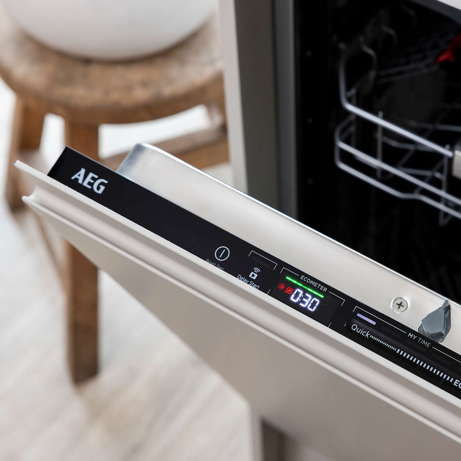 Close-up displays and settings interface of opened integrated AEG dishwasher in Yasmin Wyatt's Luna Kitchen from Magnet