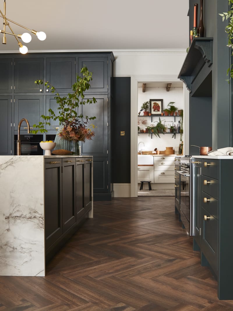 Ludlow, a traditional Shaker-style kitchen range featuring panelled doors with visible woodgrain and beading detail, in the shade Arboretum Green.