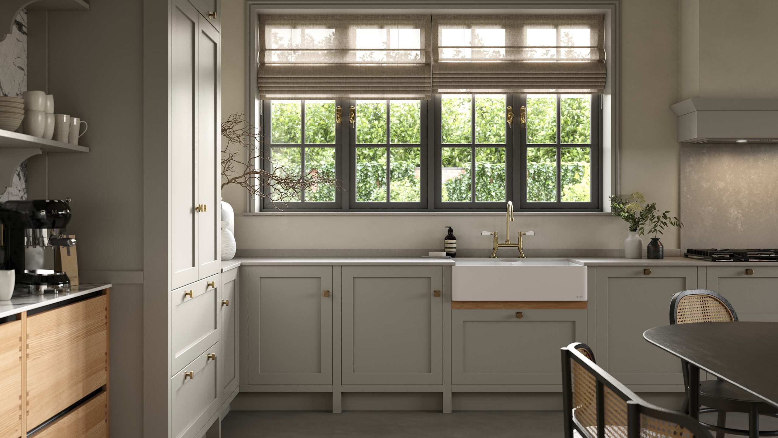 A neutral Shaker kitchen with Pebble and Nordic Craft cabinetry, belfast sink and traditional style tap.