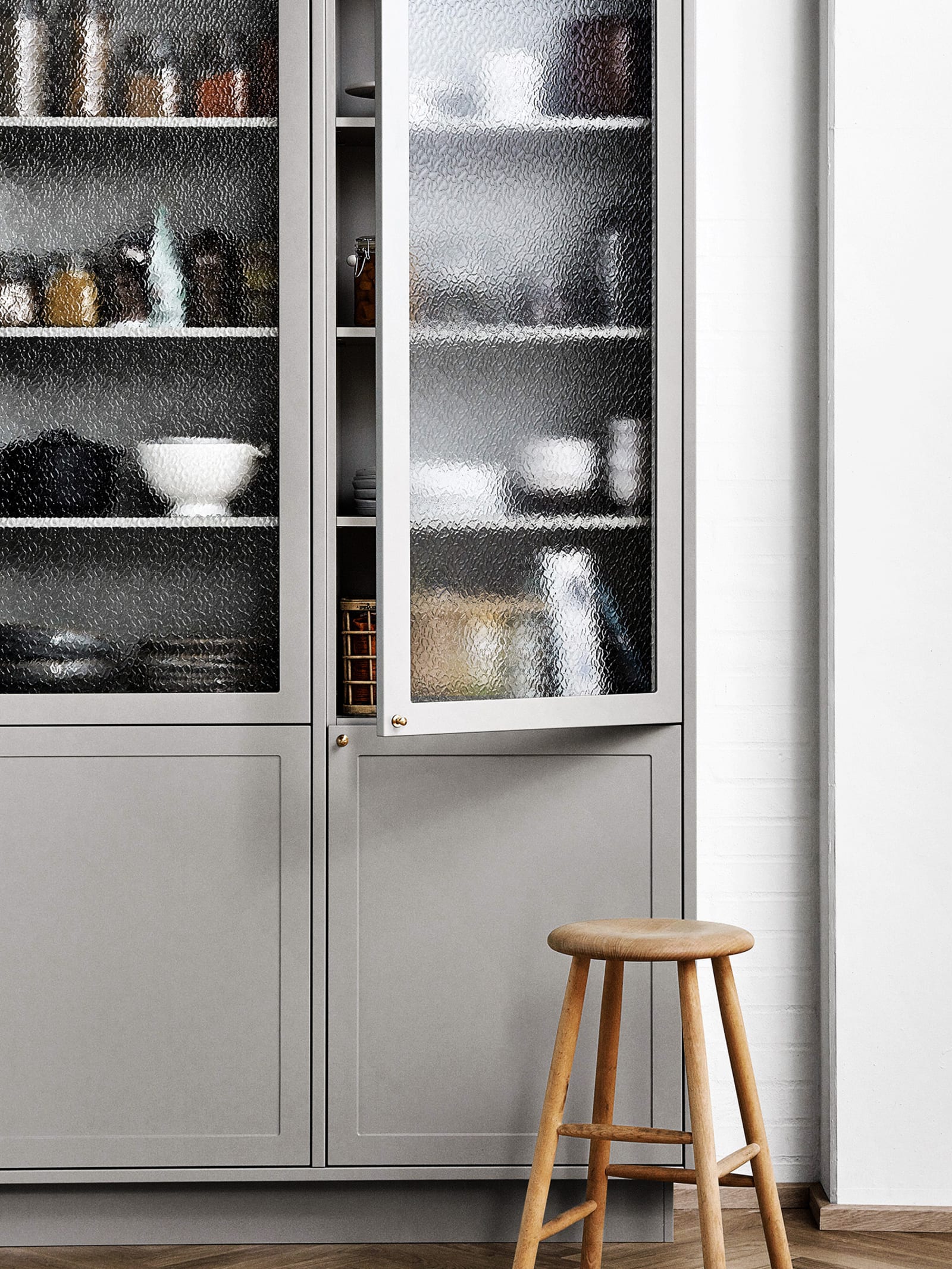 A display cabinet in your kitchen provides extra storage space