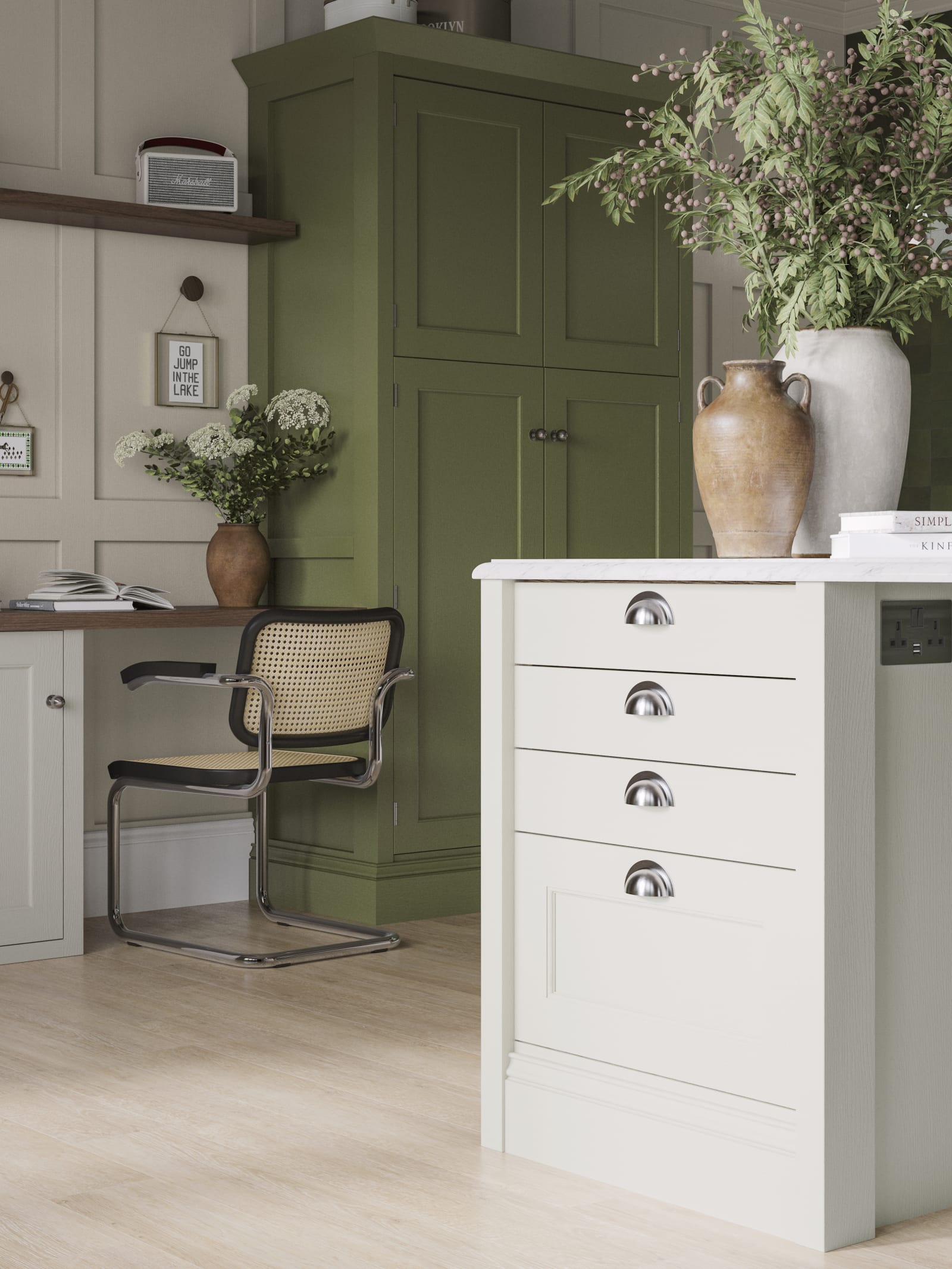 Off-white and olive green kitchen featuring shaker-style cabinetry and a desk area within the space.