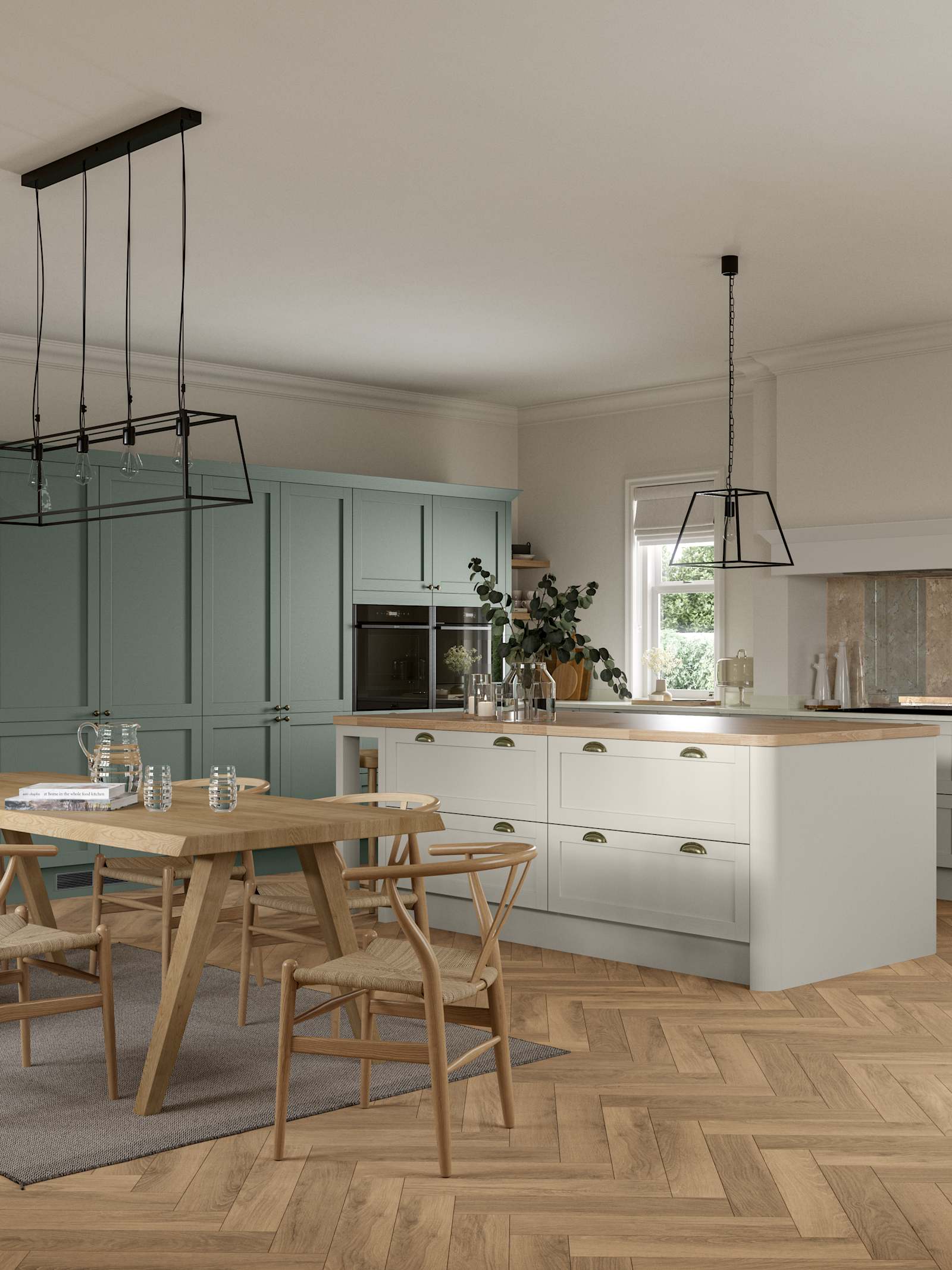 Ambleside Shaker kitchen in Moss and Limestone colours, featuring cup handles, and a spacious open-plan layout.