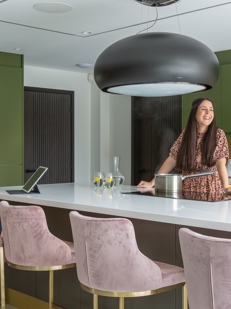 Kelly and James Godden in their calming and contemporary handleless kitchen Integra Soho in bright green and earthy brown from Magnet.