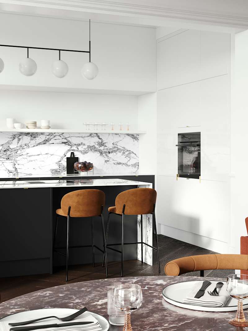Minimal maximalism with Magnet's Hoxton kitchen in Sumi Black, combined with white marbled worktop and splashbacks and colourful interiors.