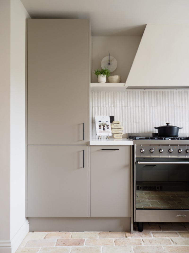 Integrated Fridge in tall neutral Soho modern slab kitchen