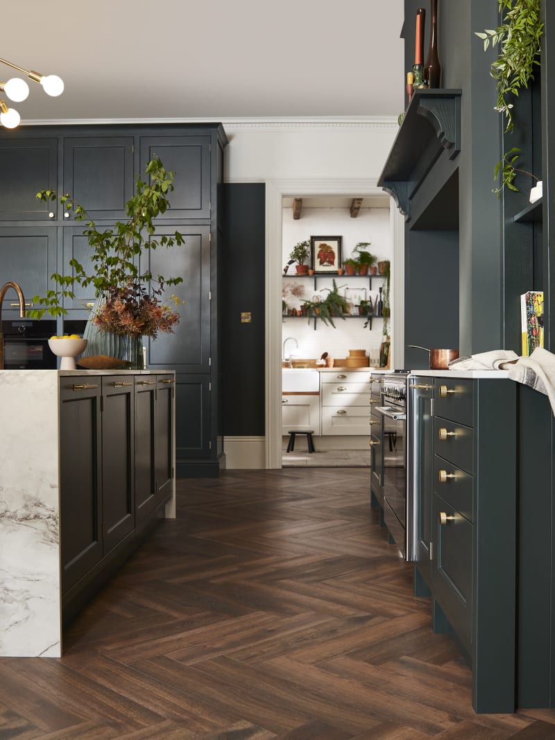 Ludlow, a traditional Shaker-style kitchen range featuring panelled doors with visible woodgrain and beading detail, in the shade Arboretum Green.