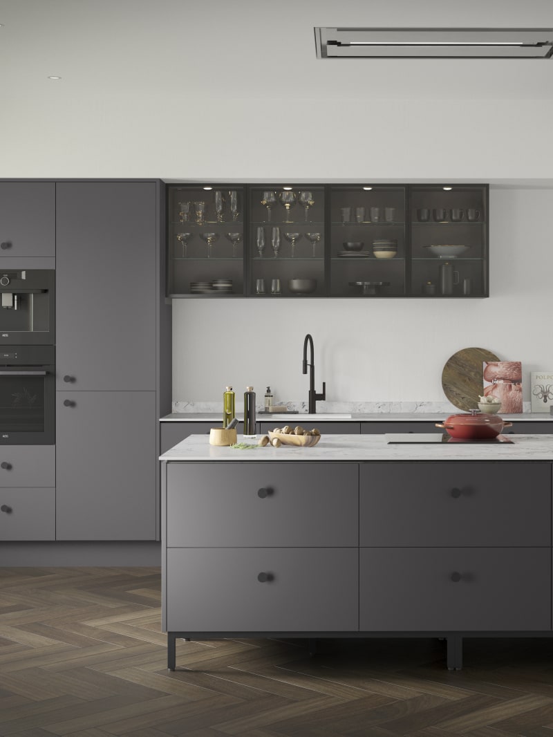 Soho Charcoals kitchen, a premium painted slab door from Magnet, with fluted glass Nordic Nature wall cabinets.