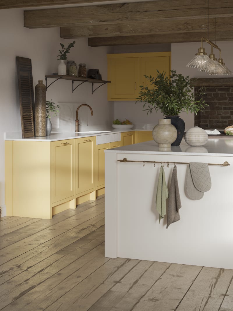 Alt text: Open floorplan shaker kitchen in the bright and beautiful yellow shade Harvest, paired with a kitchen island with matching frame door cabinets in the shade Limestone.