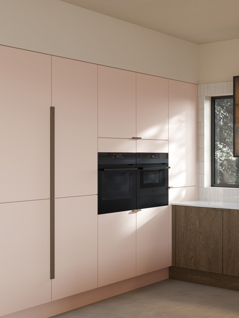 Soho cabinets in shade Chalk Blush, matched with fluted glass display cabinets and oak front cabinetry in Nordic Nature.