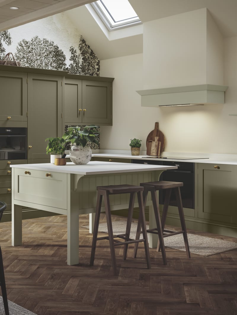 Wardley Arboretum cabinets paired with brass handles and kitchen tap makes an an elegant, contemporary Shaker kitchen, with a lighter shade kitchen island.