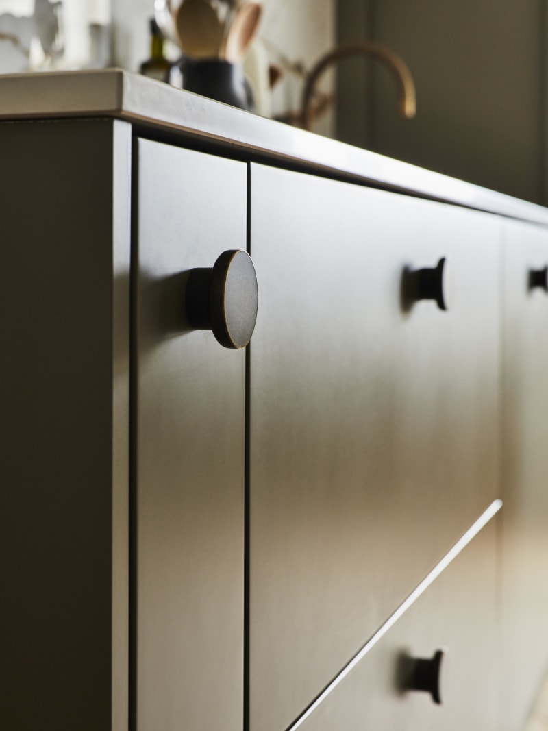 Close-up of Soho Balmoral cabinets with black circle handles