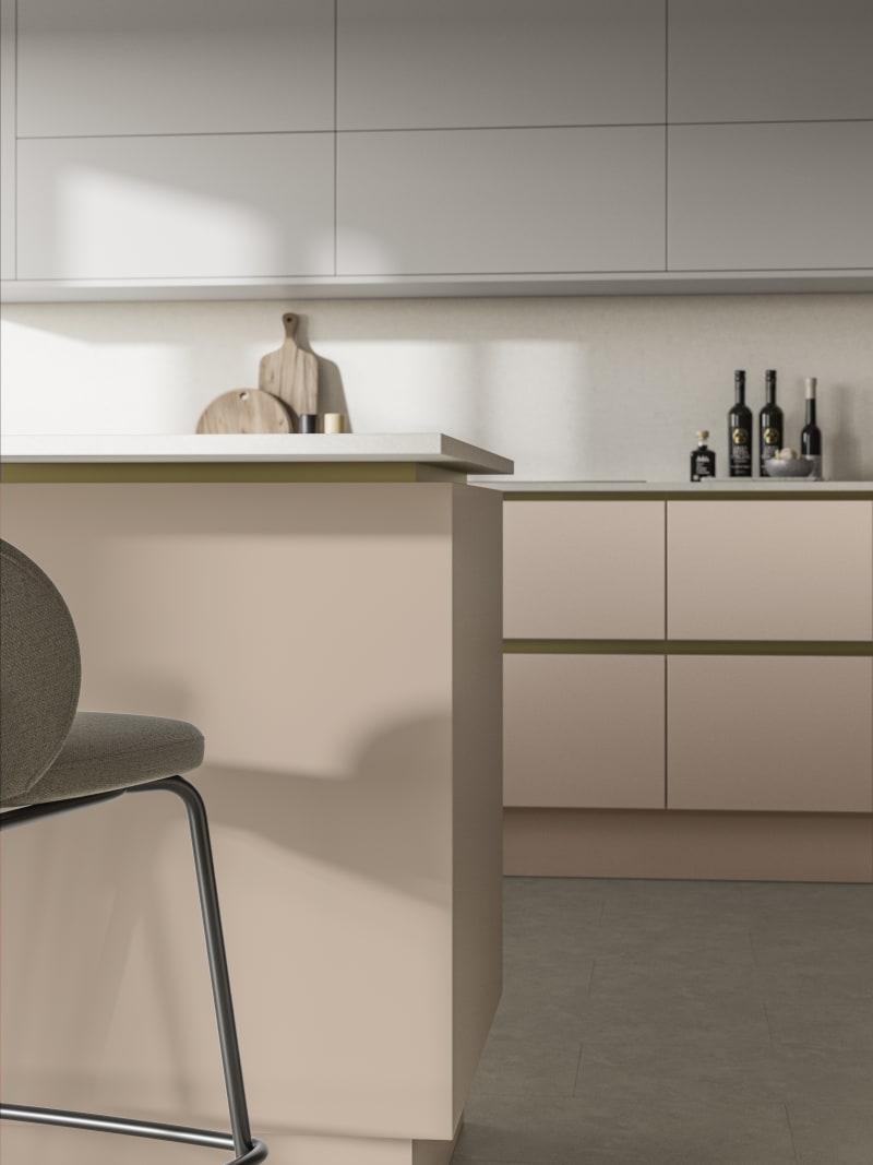 Modern and minimalist Integra Soho Chalk Blush kitchen, a frameless slab door with integrated handles in a smooth paint finish.