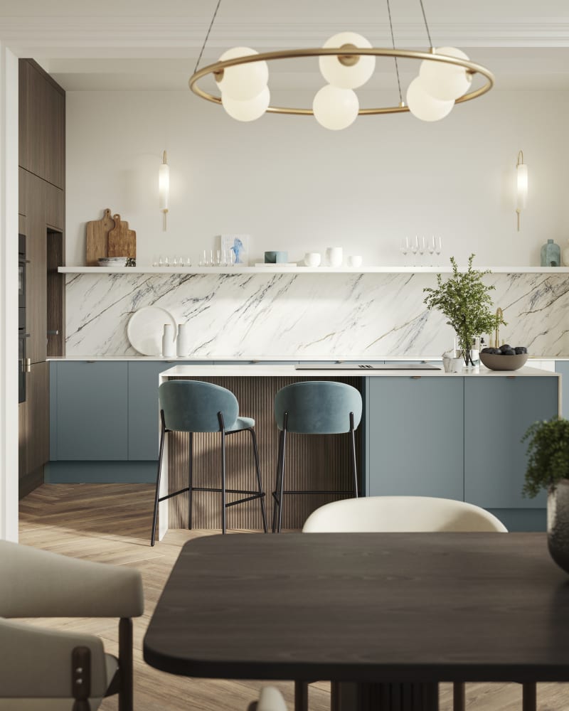 View of kitchen island in Soho Duck Blue kitchen from Magnet combined with Nordic Nature wood and paired beautifully with a marbled splashback.