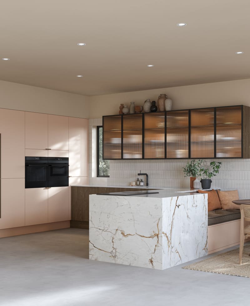 Full room view of open plan kitchen Soho Chalk Blush, matched with fluted glass display cabinets and oak front cabinetry in Nordic Nature.