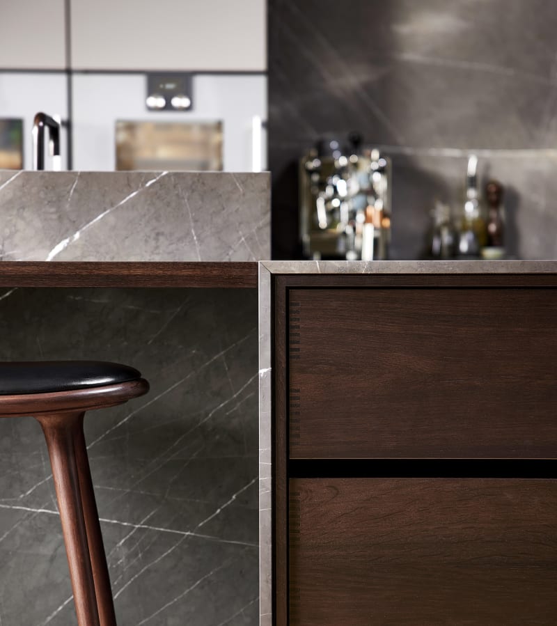 Kitchen drawers in smoked oak in combination with Pietra Grey marble