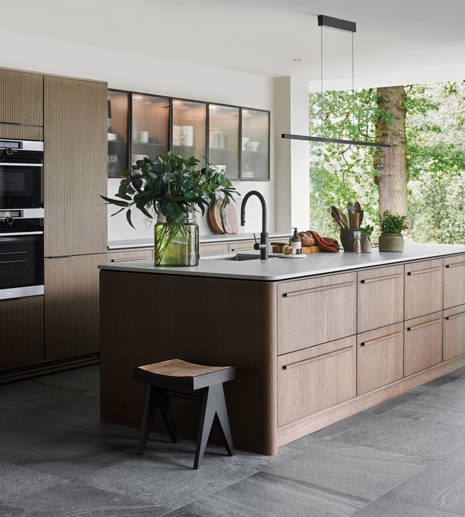 Nordic Nature. Modern wooden kitchen design with a Nordic influence. Featured floating worktops, a ribbed plinth and rounded end panels