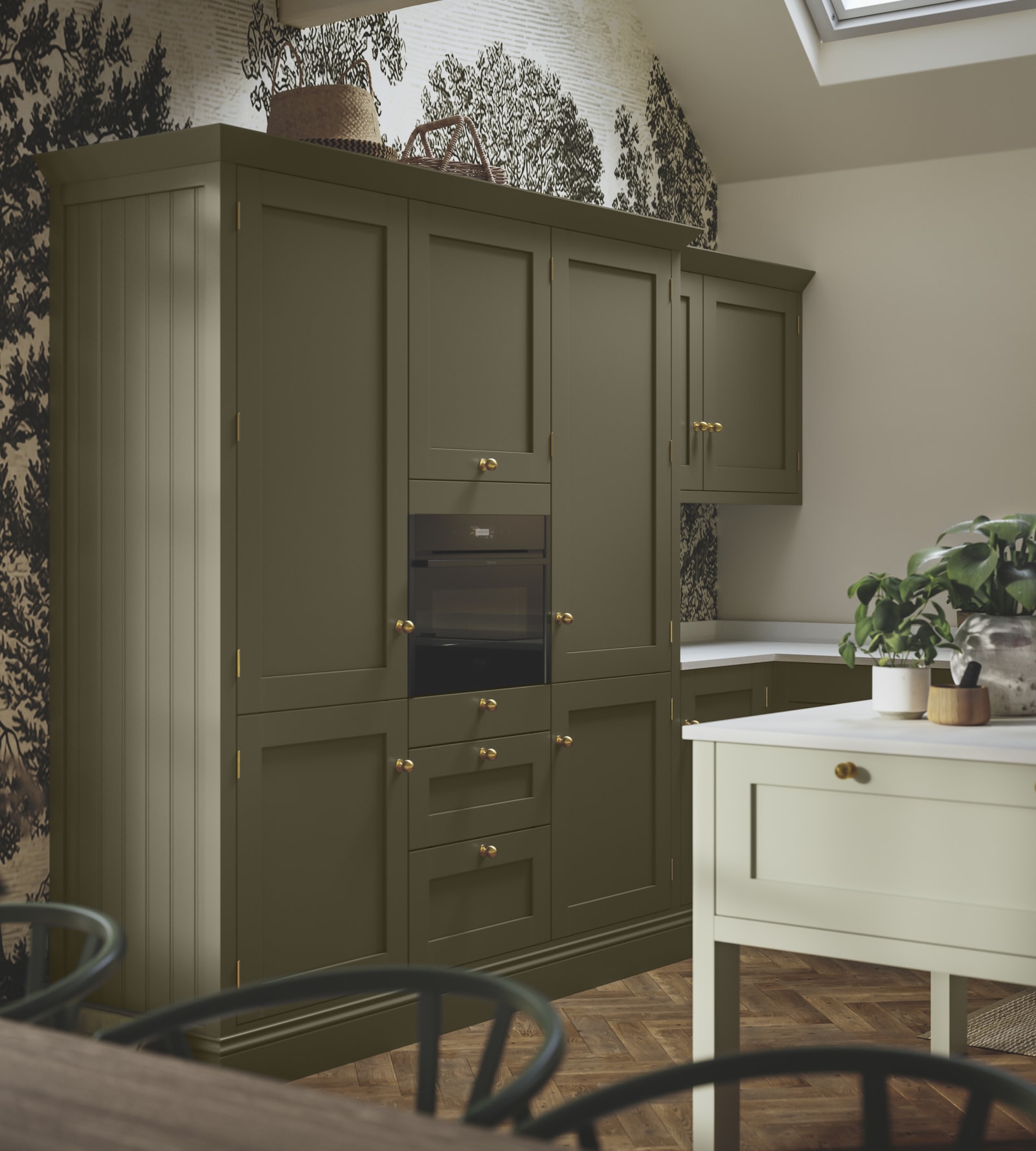 Tall Wardley Arboretum kitchen cabinets and a lighter kitchen island, all with brass details.