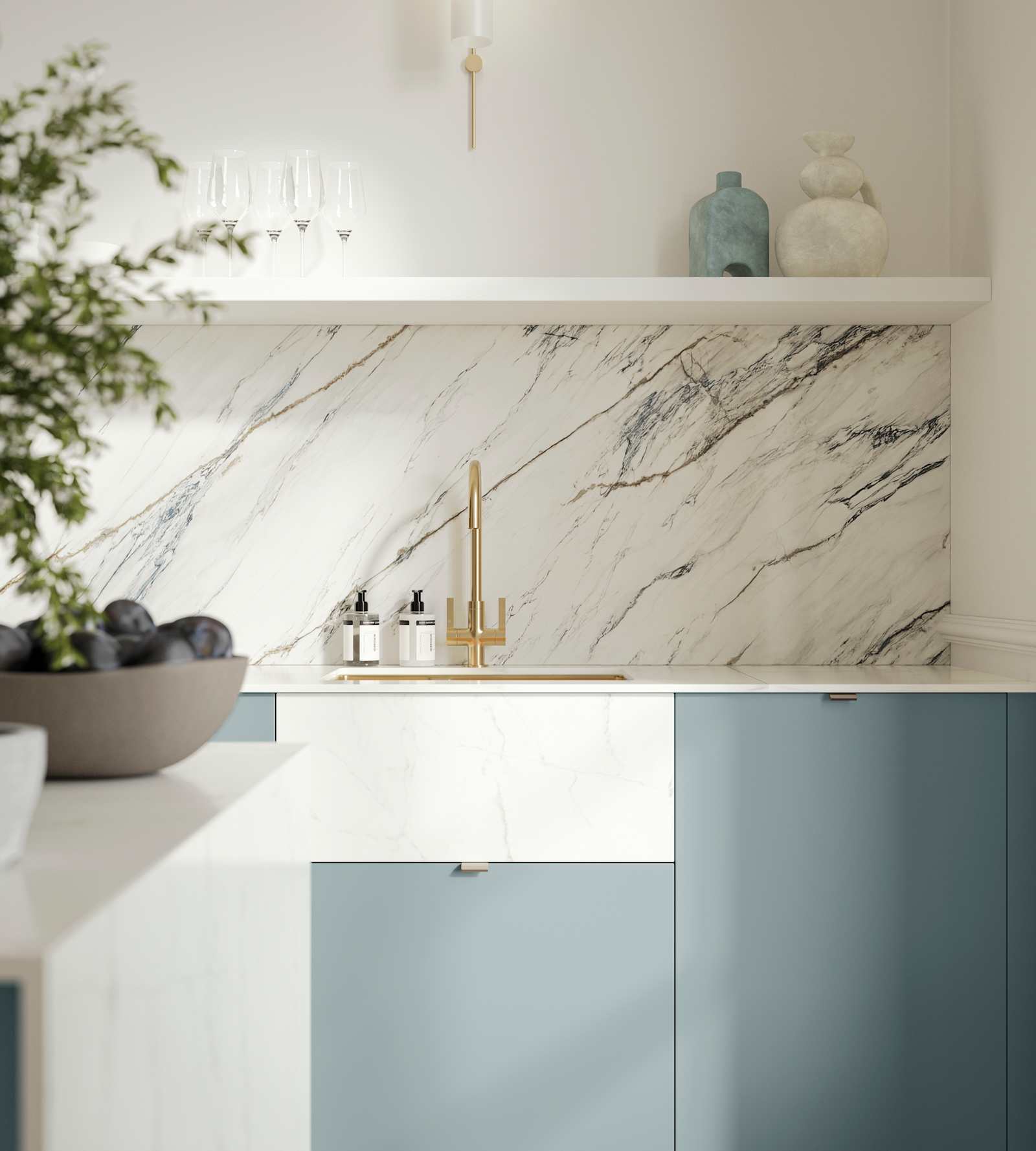 Soho Duck Blue kitchen from Magnet with white marble splashblack, paired beautifully with a bright brass tap and sink.