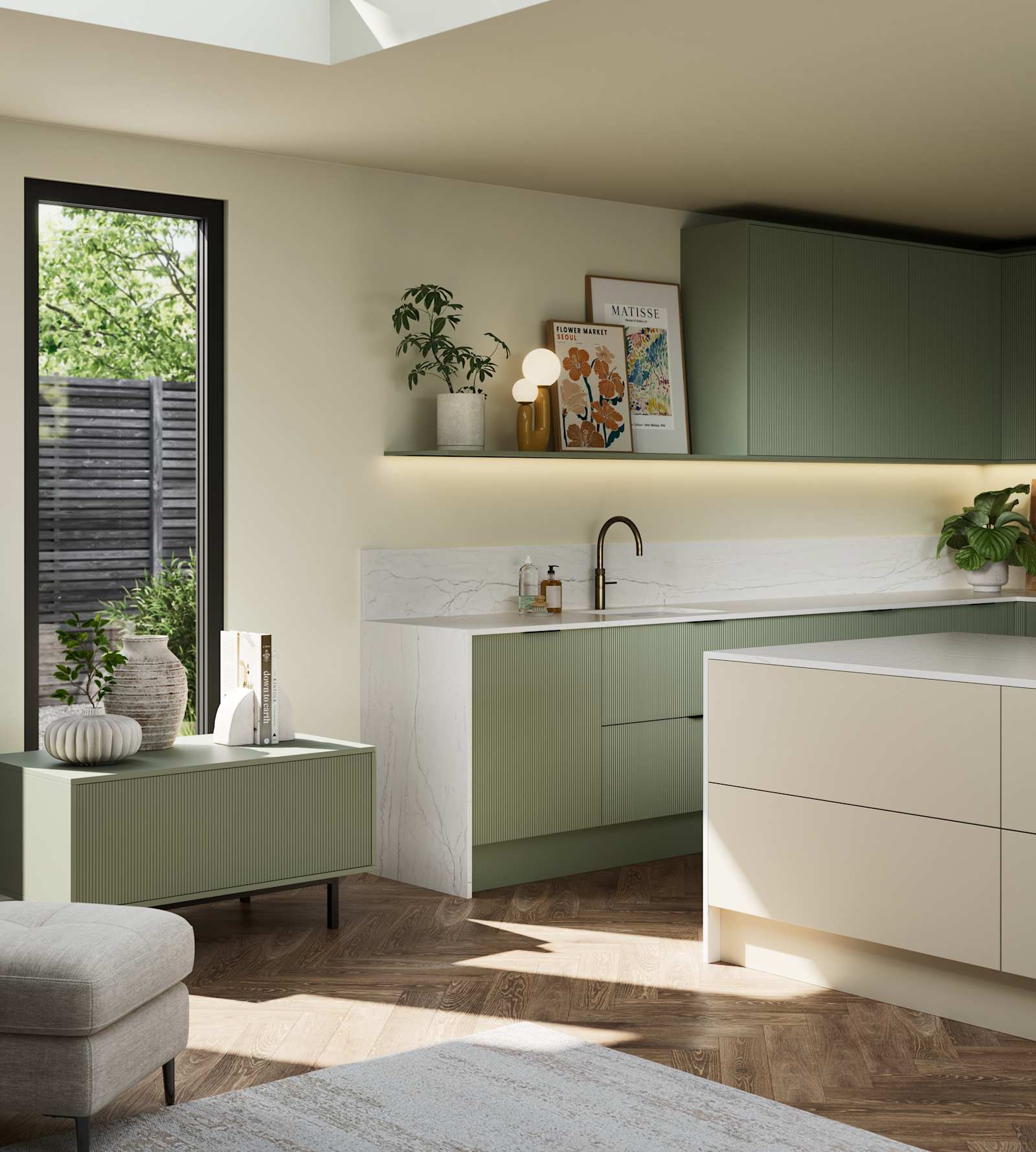 Green fluted kitchen fronts on tall cabinets with built-in appliances and black handles, light neutral shade handleless kitchen island and green sideboard on metal legs.