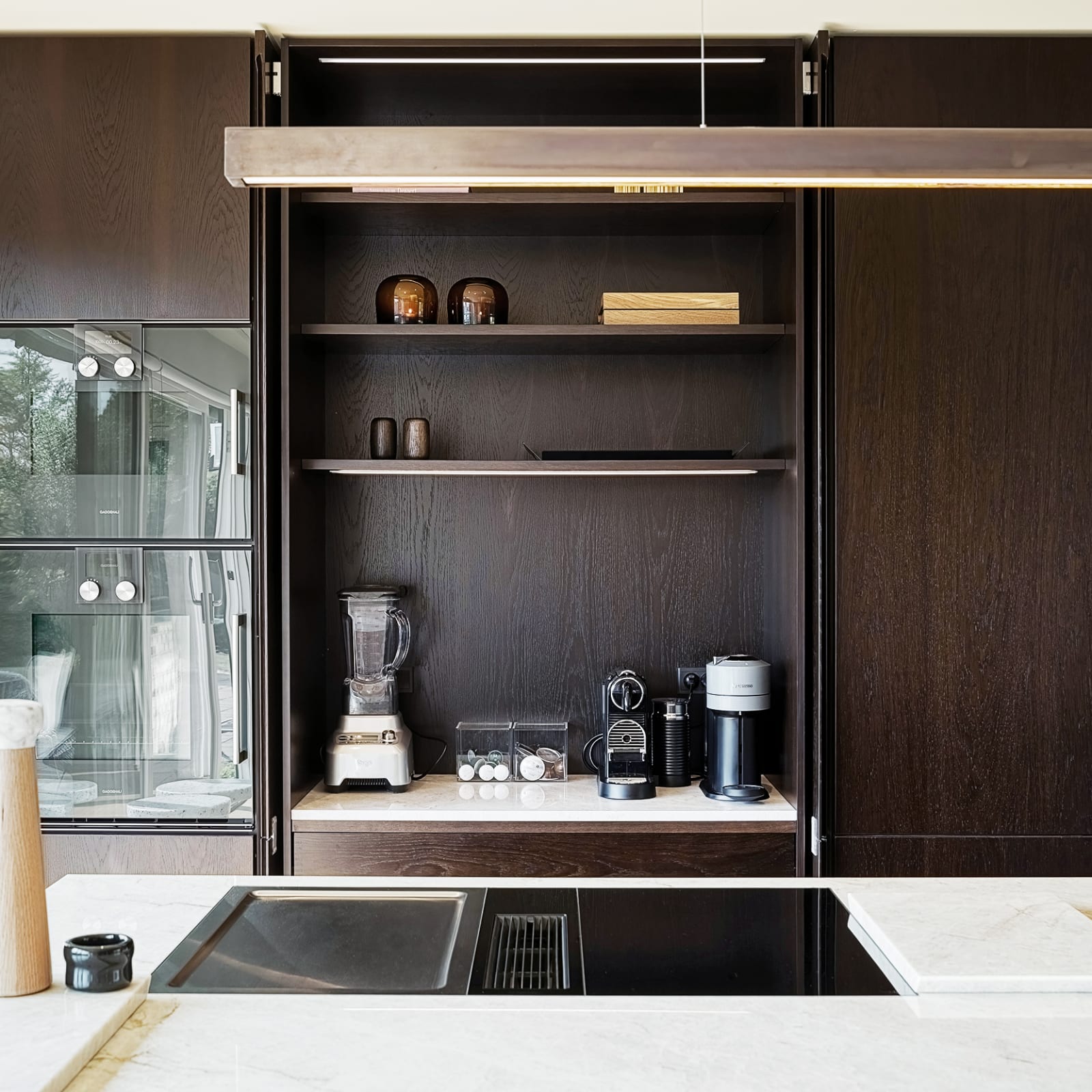 Bespoke kitchen in smoked oak and Quartzite