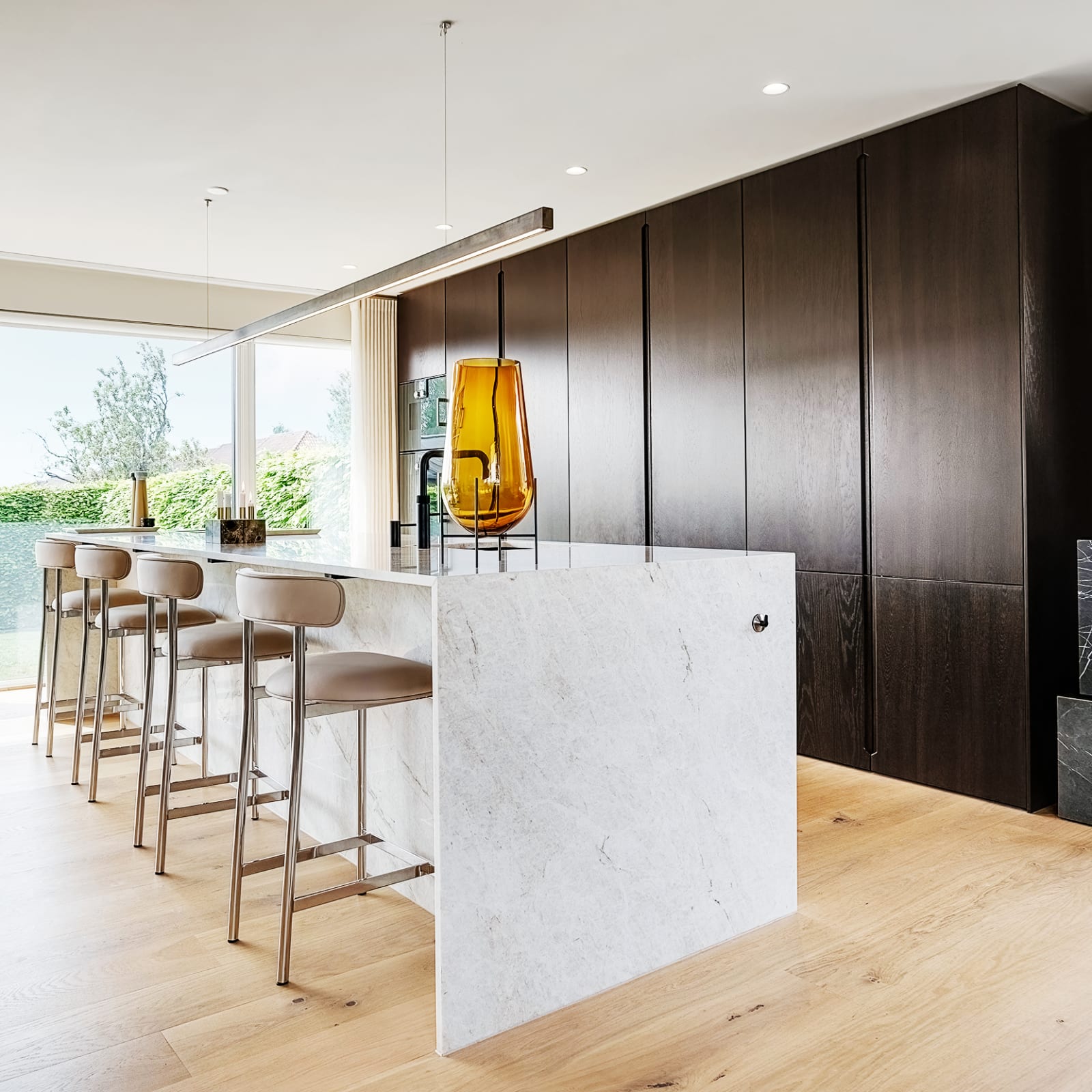 Tall cabinets in smoked oak from floor to ceiling