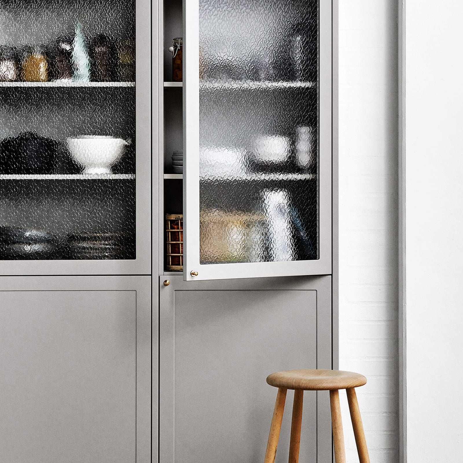 A display cabinet in your kitchen provides extra storage space