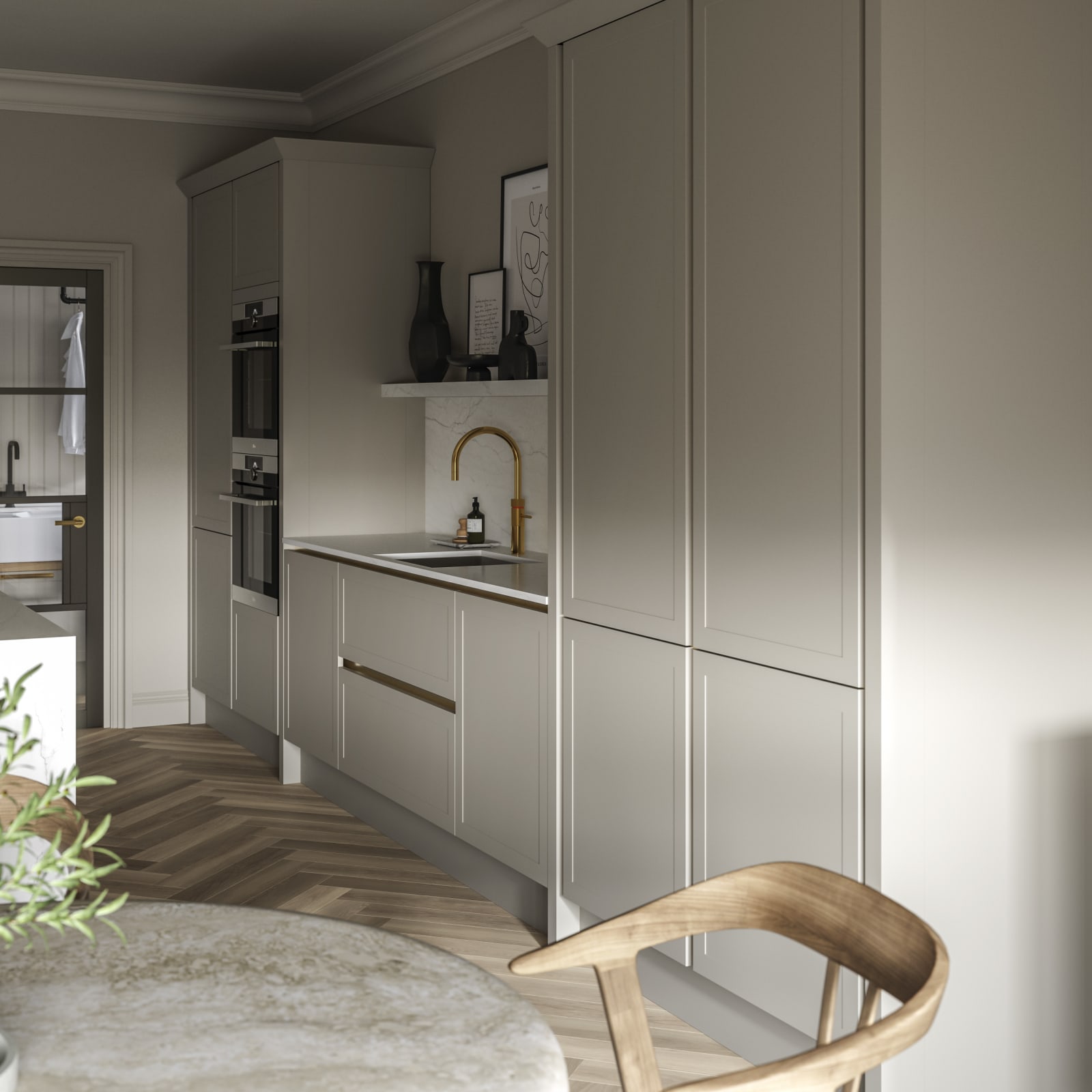 Integra Dunham Pebble path tall cabinets in neutral kitchen decorated with plants and brass tap