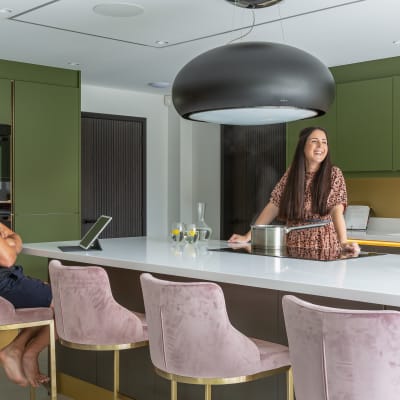 Kelly and James Godden in their calming and contemporary handleless kitchen Integra Soho in bright green and earthy brown from Magnet.