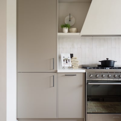 Integrated Fridge in tall neutral Soho modern slab kitchen