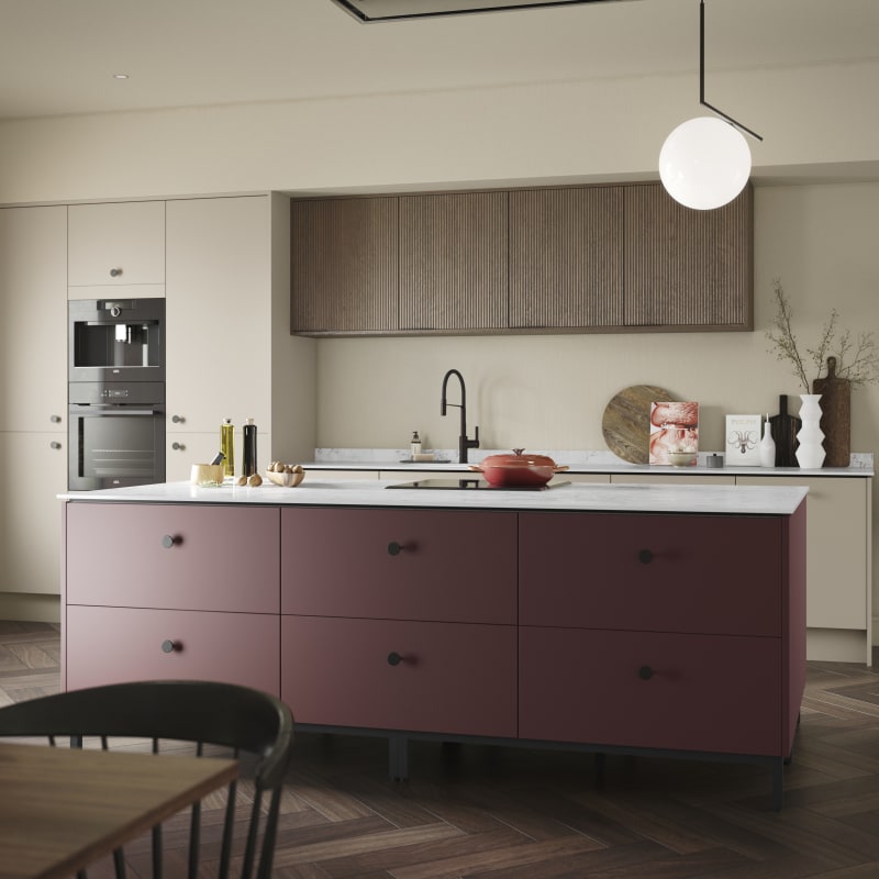 Soho kitchen in neutral color with Nordic Nature fluted wall cabinets and Burlington Red kitchen island, a painted premium slab door from Magnet.