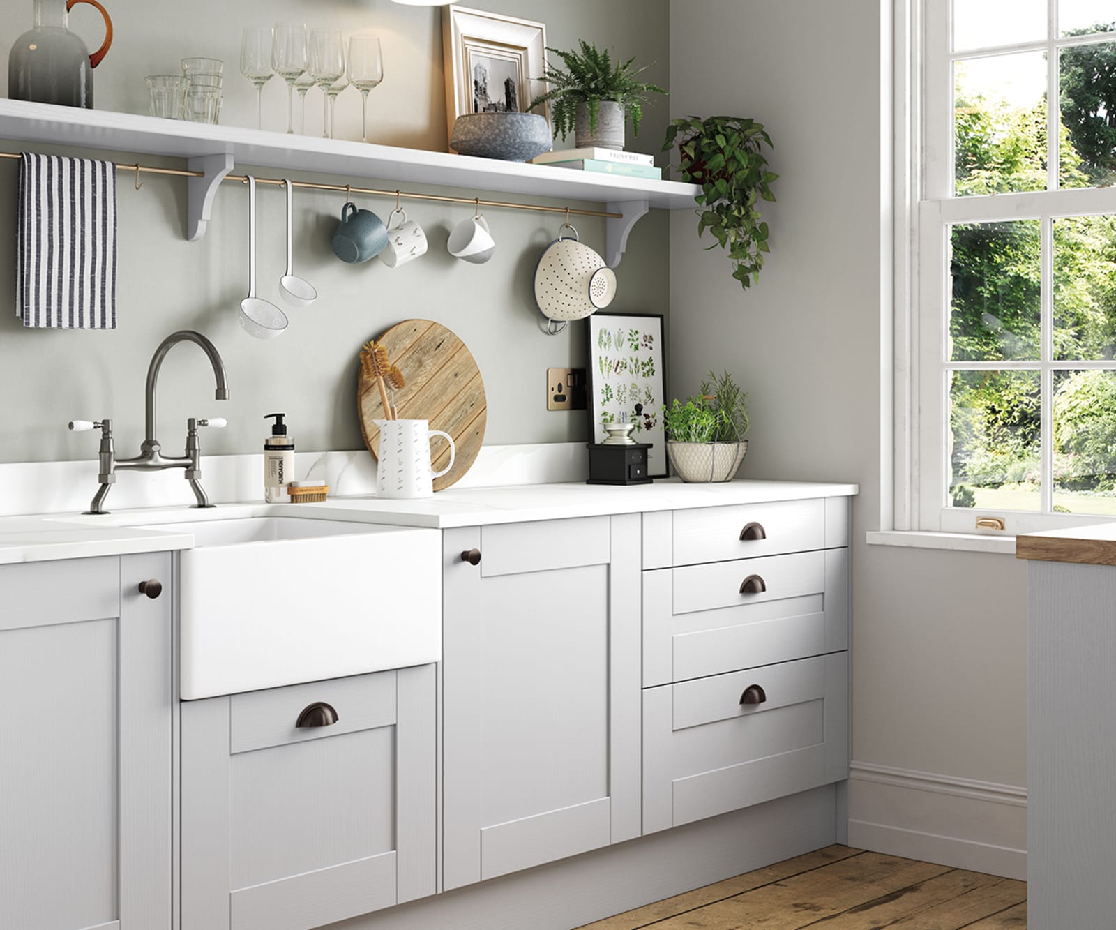 Winchester Dove grey, the wood grain effect affordable traditional kitchen by Magnet, with belfast sink and hanging kitchen utensils below an open wall shelf.