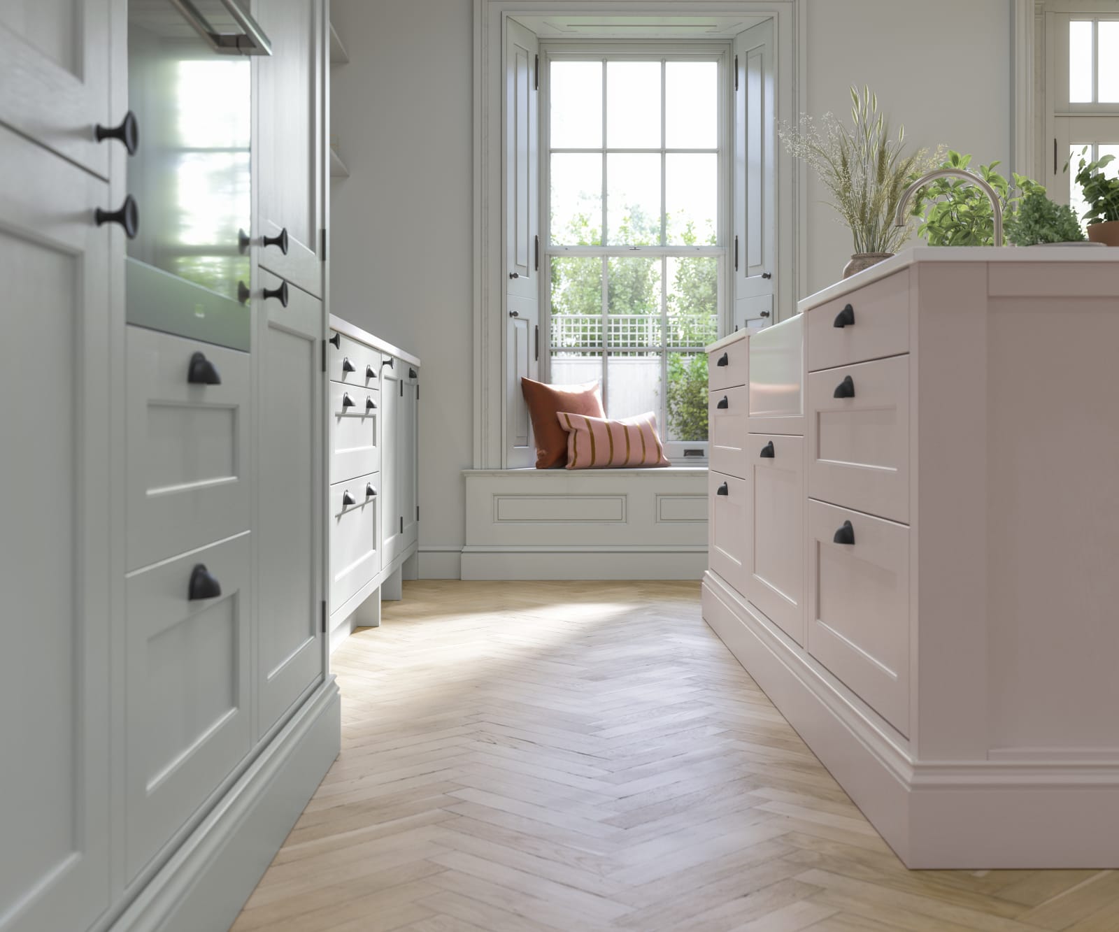 Ludlow, a traditional Shaker-style kitchen range featuring panelled doors with visible woodgrain and beading detail, in the light airy shade Seagrass.