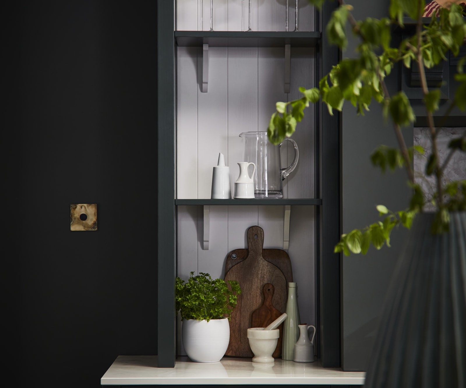 Ludlow, a traditional Shaker-style kitchen range featuring panelled doors with visible woodgrain and beading detail, in the shade Arboretum Green.