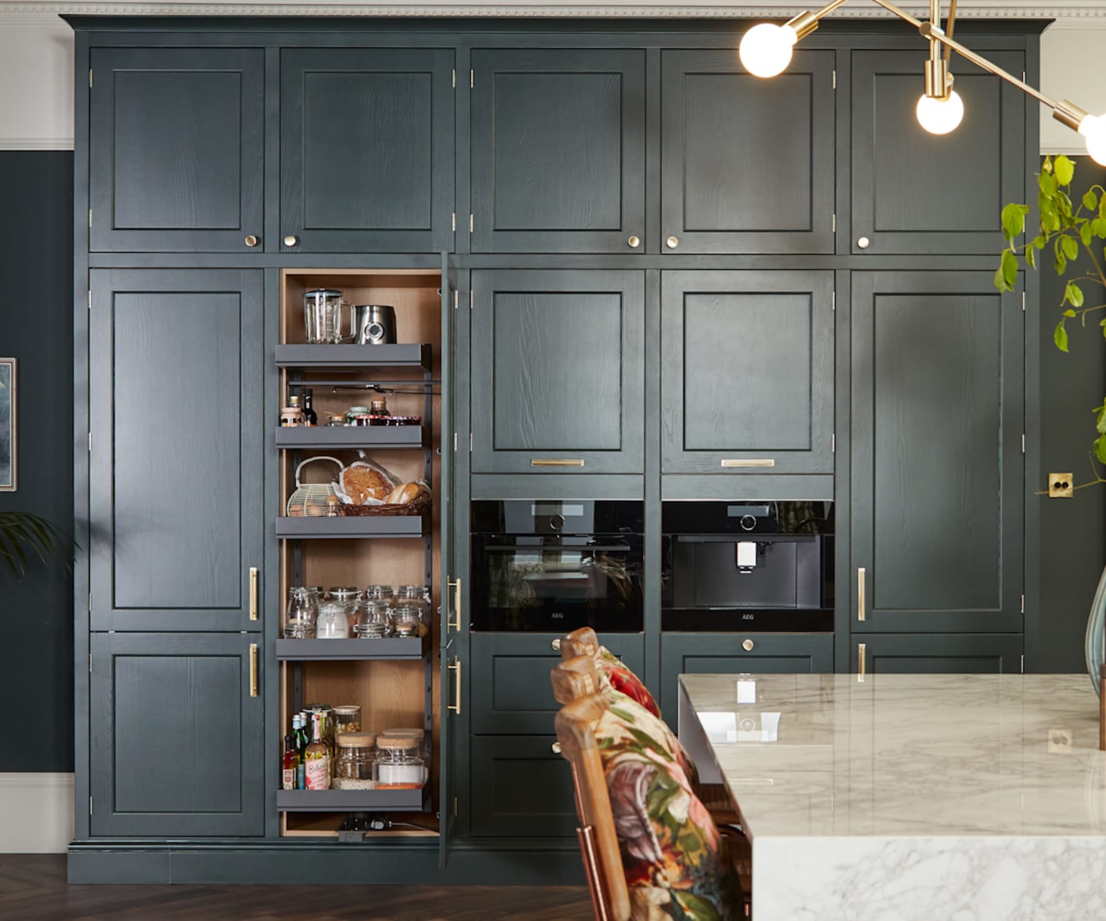 Ludlow, a traditional Shaker-style kitchen range in the shade Arboretum Green, kitchen larder.