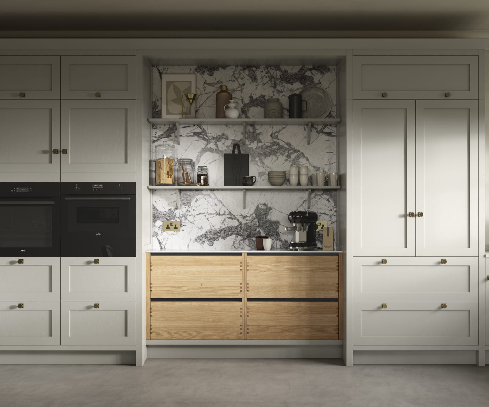 A neutral Shaker kitchen with Pebble and Nordic Craft cabinetry, marble splashback behind open shelves and paired with brass handles.