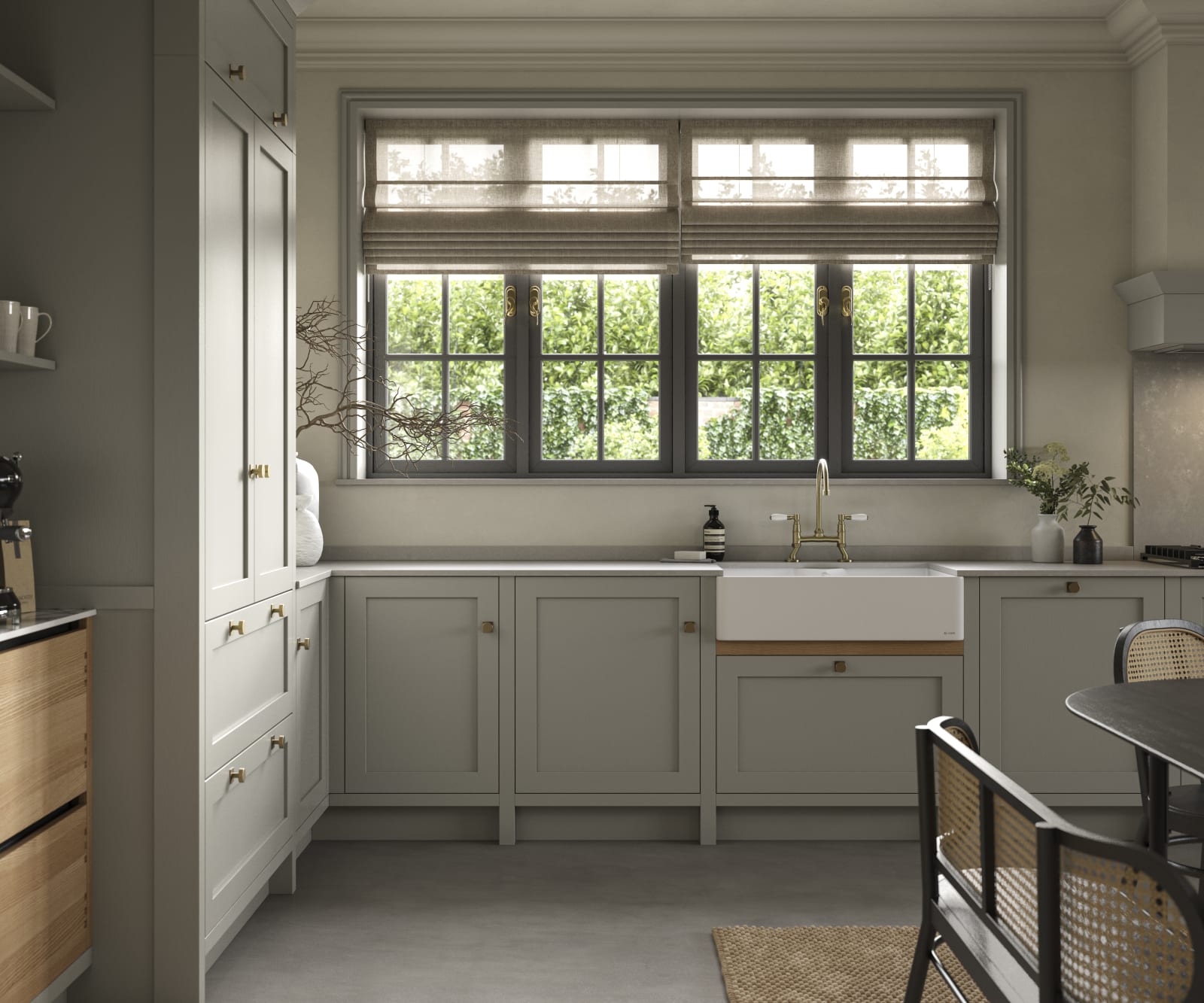 A neutral Shaker kitchen with Pebble and Nordic Craft cabinetry, belfast sink and traditional style tap.