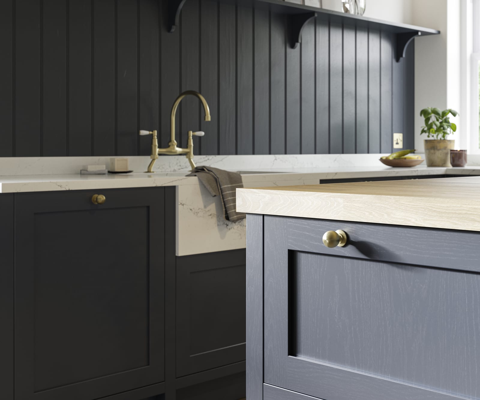 Closeup of dark blue Shaker kitchen Wardley, with painted timber finish and narrow framing. Paired with a brass kitchen tap and blue matching wall panelling.