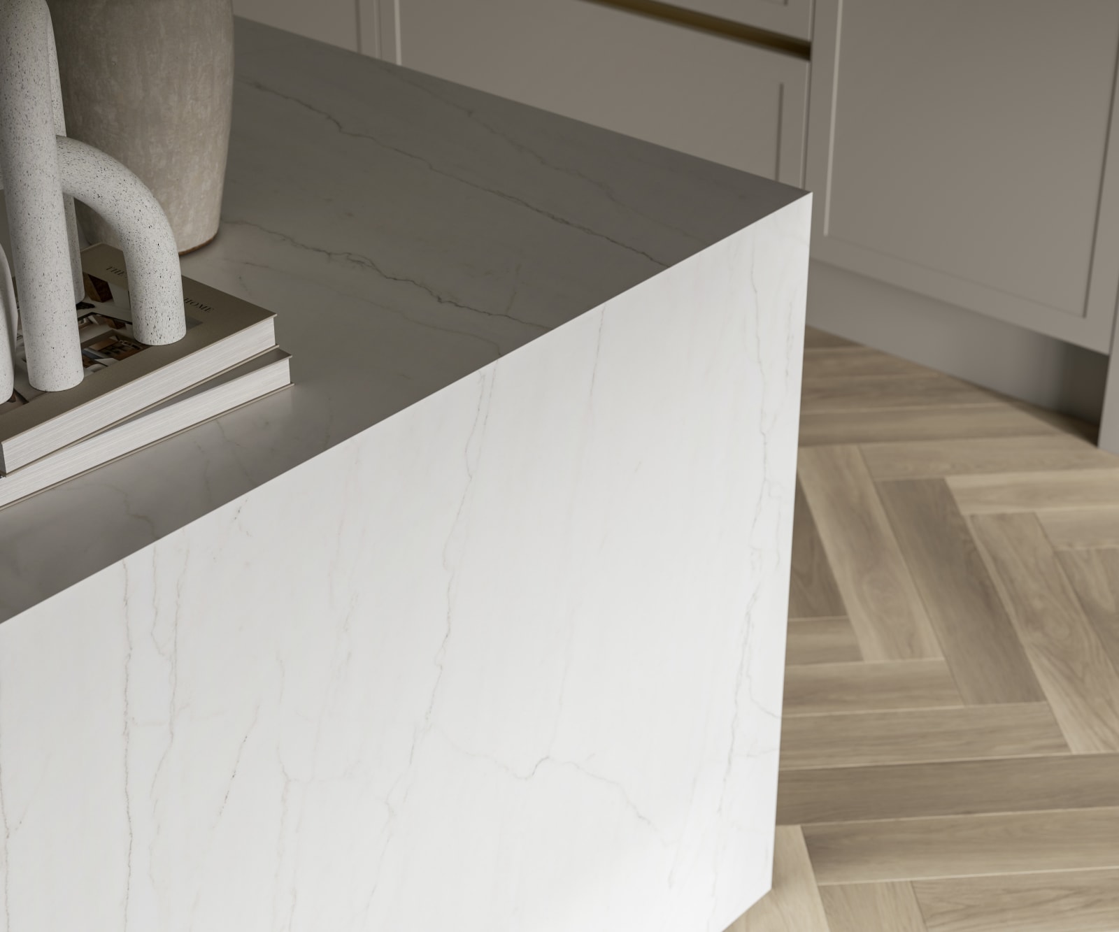 Close-up of Kitchen island with marble worktop and decorative side panel.