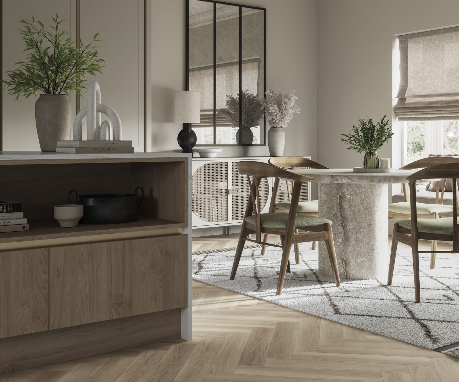 Integra Ascoli kitchen, close-up view of kitchen island with dining table in background. Light and earthy toned interior with plants.