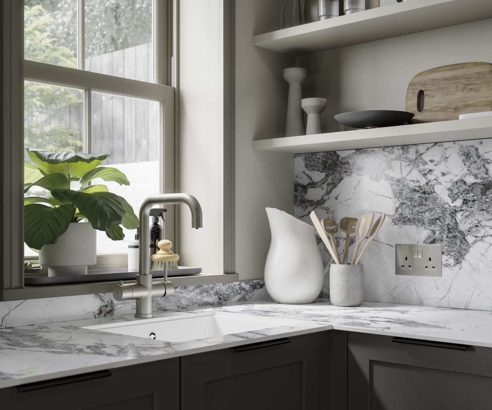 Close-up of marble worktop and backsplash in dark grey shaker kitchen.